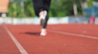 man Runner in a stadium on background