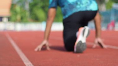 man Runner in a stadium on background