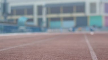 man Runner in a stadium on background