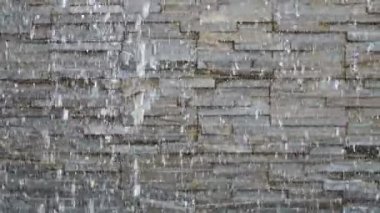 water flowing through the pond on background