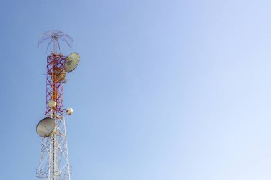 A large communication tower in the background is the sky. Telephone towers. There is space for content.