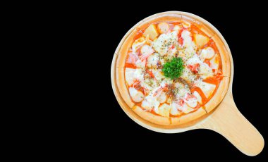 Pizza in an appetizing wooden tray on background, close up