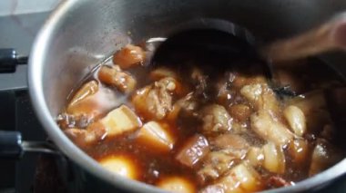 Stewed eggs and pork belly in a hot pot. home cooking ideas