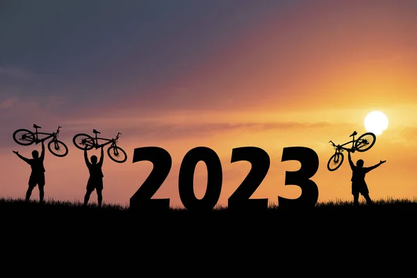 Bicycle adventurous tourists carrying bicycles over obstacles. happy new year 2023