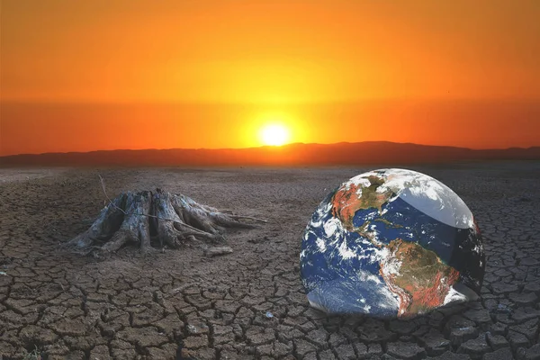 The concept of global warming and drought and poverty and food shortages. Arid soils with hot climates have a globe that lacks green space.