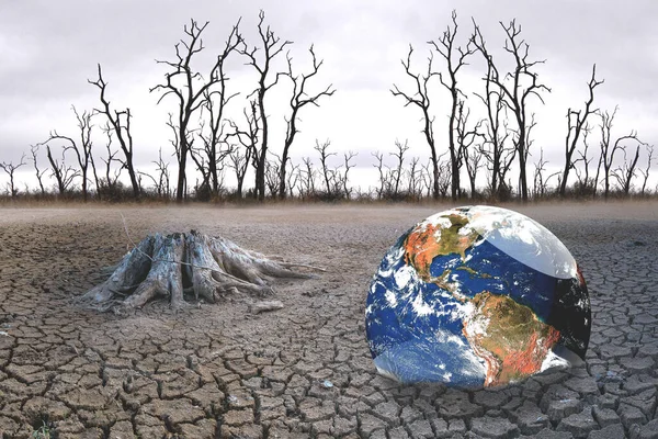 The concept of global warming and drought and poverty and food shortages. Arid soils with hot climates have a globe that lacks green space.