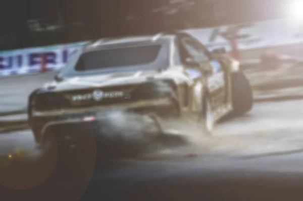 Lens blur of car racing. car race background concept