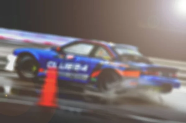 Lens blur of car racing. car race background concept