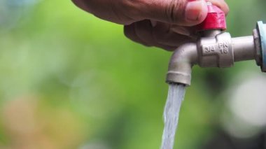 The concept of water crisis and despair from lack of clean water caused by drought. The faucet has no running water.