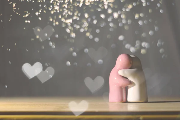 Clay dolls are hugging each other in love. Concept of love, care and nostalgia