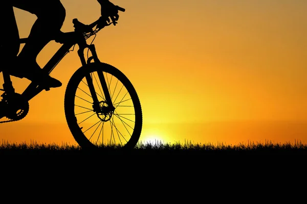 Silhouettes of cyclist and bike exercise at the sunset. travel concept