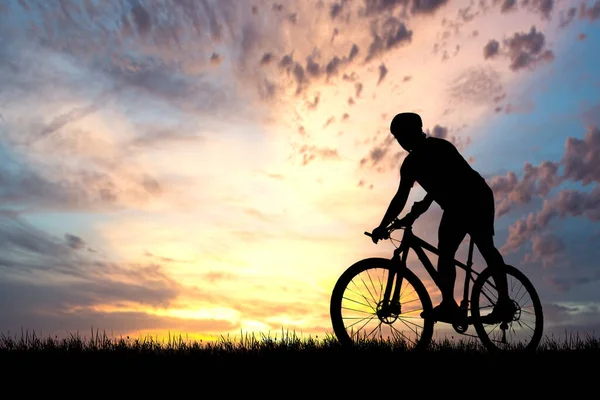 Silhouettes of cyclist and bike exercise at the sunset. travel concept