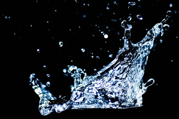 Splashing water on a black background. water droplets scattered on a black background