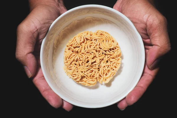 Instant noodles in a cup. food crisis concept food shortage