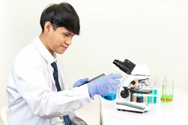Young Attractive Asian Scientist Working Chemical Laboratory Searching Data Tablet — Stockfoto