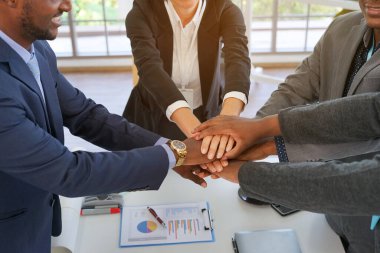 business people hands stacked together. successful business  teamwork concept                                                                           