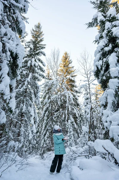 Young Girl Walks Winter Forest Tall Fir Trees Covered Snow — Stock fotografie