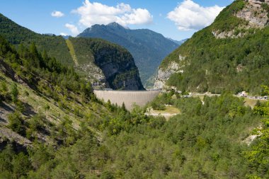 The Vajont disaster occurred on 9 October 1963, when a landslide broke off from Mount Toc and fell into the basin causing a wave that went over the dam and destroyed the town of Longarone, causing 2000 victims.