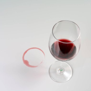 the imprint of red wine left by a glass on a white surface