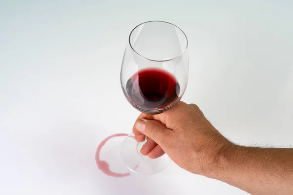 the imprint of red wine left by a glass on a white surface