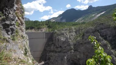 The Vajont disaster occurred on 9 October 1963, when a landslide broke off from Mount Toc and fell into the basin causing a wave that went over the dam and destroyed the town of Longarone, causing 2000 victims.