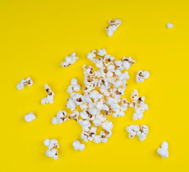 Pop corn on a yellow surface