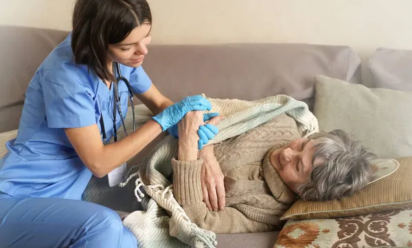 Happy retired woman and trust between doctor and patient. — Stock Photo, Image