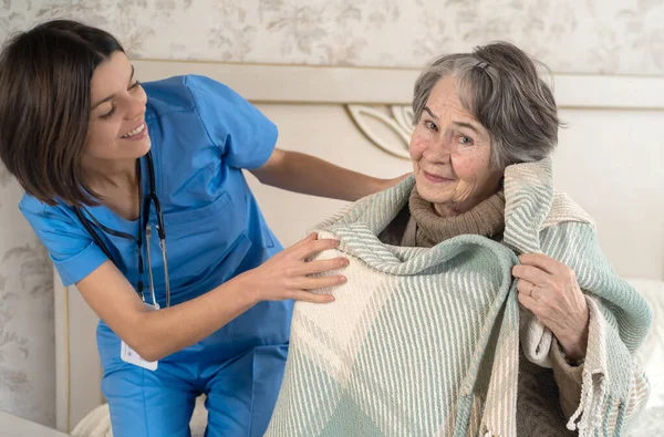Happy retired woman and trust between doctor and patient. — Stock Photo, Image