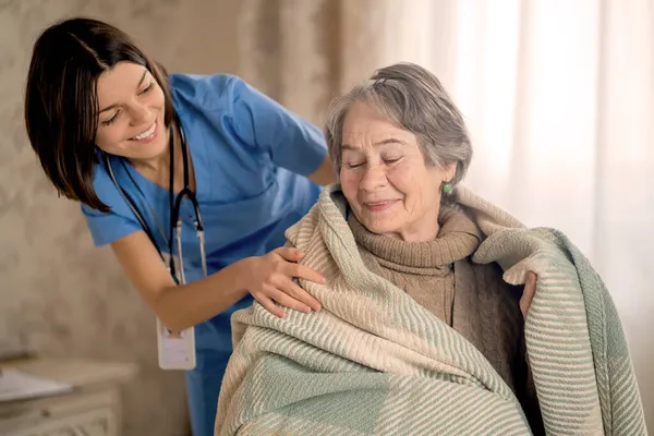 Happy retired woman and trust between doctor and patient. — Stock Photo, Image