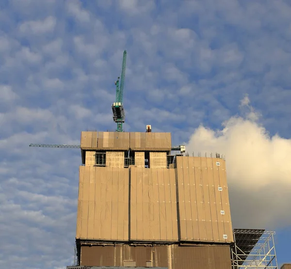 Scaffolding for dust protection on construction site of the new building.