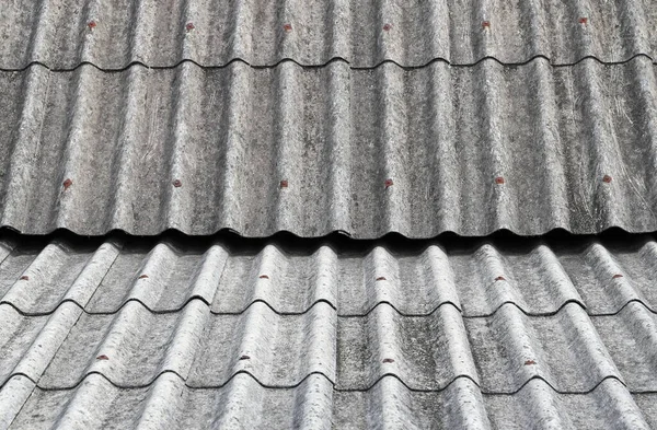 Old Asbestos cement roofing sheets, Asbestos roof, Corrugated Asbestos Cement Roof Sheet, corrugated panels, Gray slate texture,  Gray wavy slate roof pattern background.