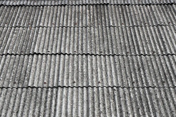 Old Asbestos cement roofing sheets, Asbestos roof, Corrugated Asbestos Cement Roof Sheet, corrugated panels, Gray slate texture,  Gray wavy slate roof pattern background.