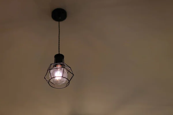 Modern Black decorative lamp hanging from the ceiling.