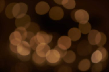 Tatil bulanık altın bokeh arka plan, parıltı, ışık efekti, parti. Bokeh odaklı olmayan ışıklarla bulanık renk ışığı soyut arkaplan