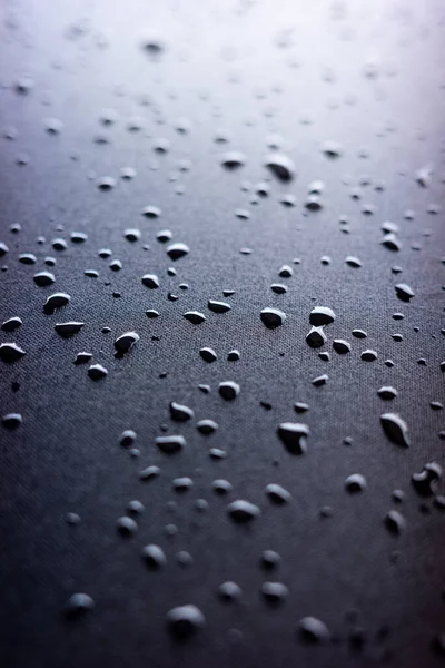 Selective Focus Water Drops Slippy Surface Black Synthetic Fabric Bright — Stock Photo, Image