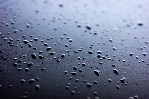 Selective Focus Water Drops Slippy Surface Black Synthetic Fabric Bright — Stock Photo, Image