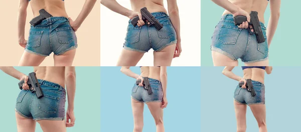 Jovem Mulher Calções Jeans Segura Uma Pistola Preta Suas Mãos — Fotografia de Stock