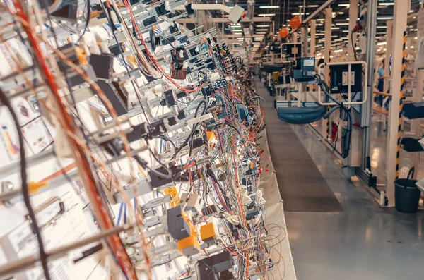 Line with electrical cables at factory. Selective focus.