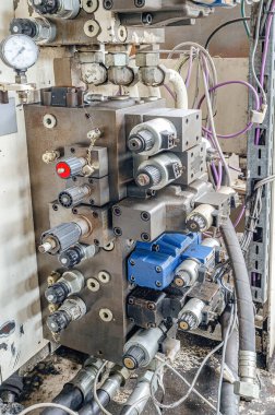 Switches, manometer, buttons. Hoses, wires. Part of industrial equipment