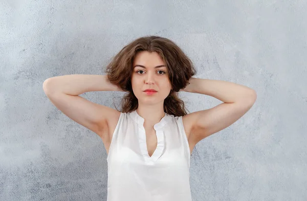 Portrait Girl White Blouse She Holds Her Hands Head Looks — Fotografia de Stock