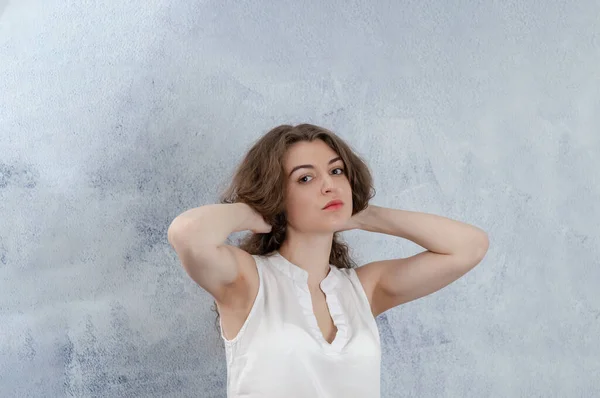 Portrait Girl White Blouse She Holds Her Hands Head Looks — Foto de Stock