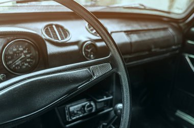 Fagment of interior of old Zhiguli car. Toolbar. Helm.