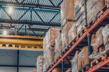 Background cardboard boxes inside warehouse. Logistics center. The composition filled with cardboard boxes