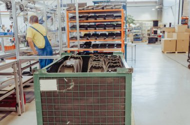 Modern interior of warehouse of finished products. Gray plastic lamps for street lighting.