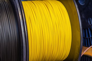 Production of wire, cable in bobbins at plant. Cable plant.