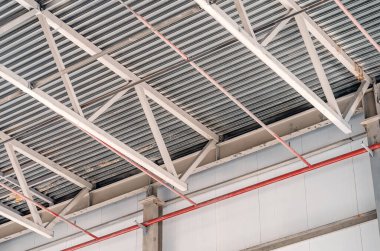 Metal trusses. Ceiling of industrial workshop.