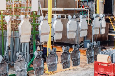 Metal steel industrial hangers, which are used for hanging parts of industrial production. Strong, rough, industrial tools