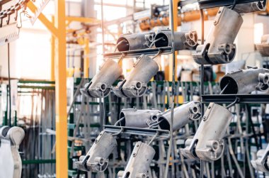 Metal steel industrial hangers, which are used for hanging parts of industrial production. Strong, rough, industrial tools