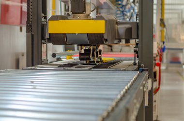 Front view cardboard packaging machine. Production line of packaging. Industry