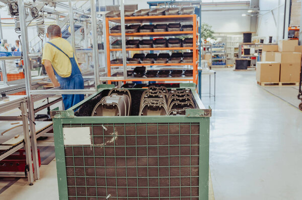 Modern interior of warehouse of finished products. Gray plastic lamps for street lighting.